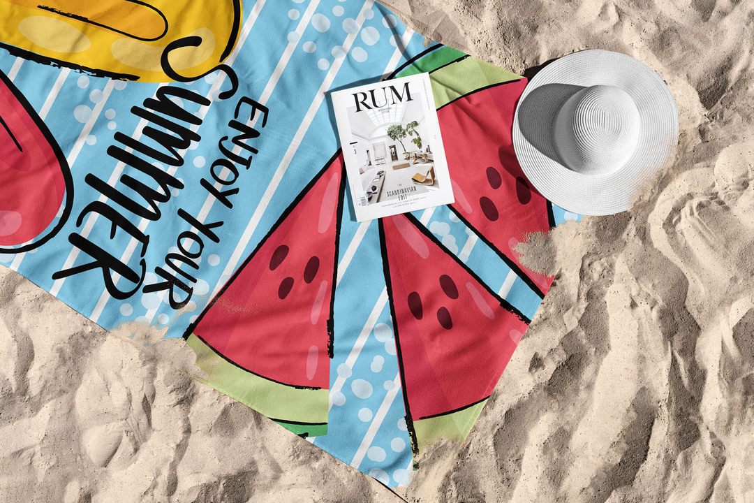 SQUARE beach towel spread on the sand with summer accessories
